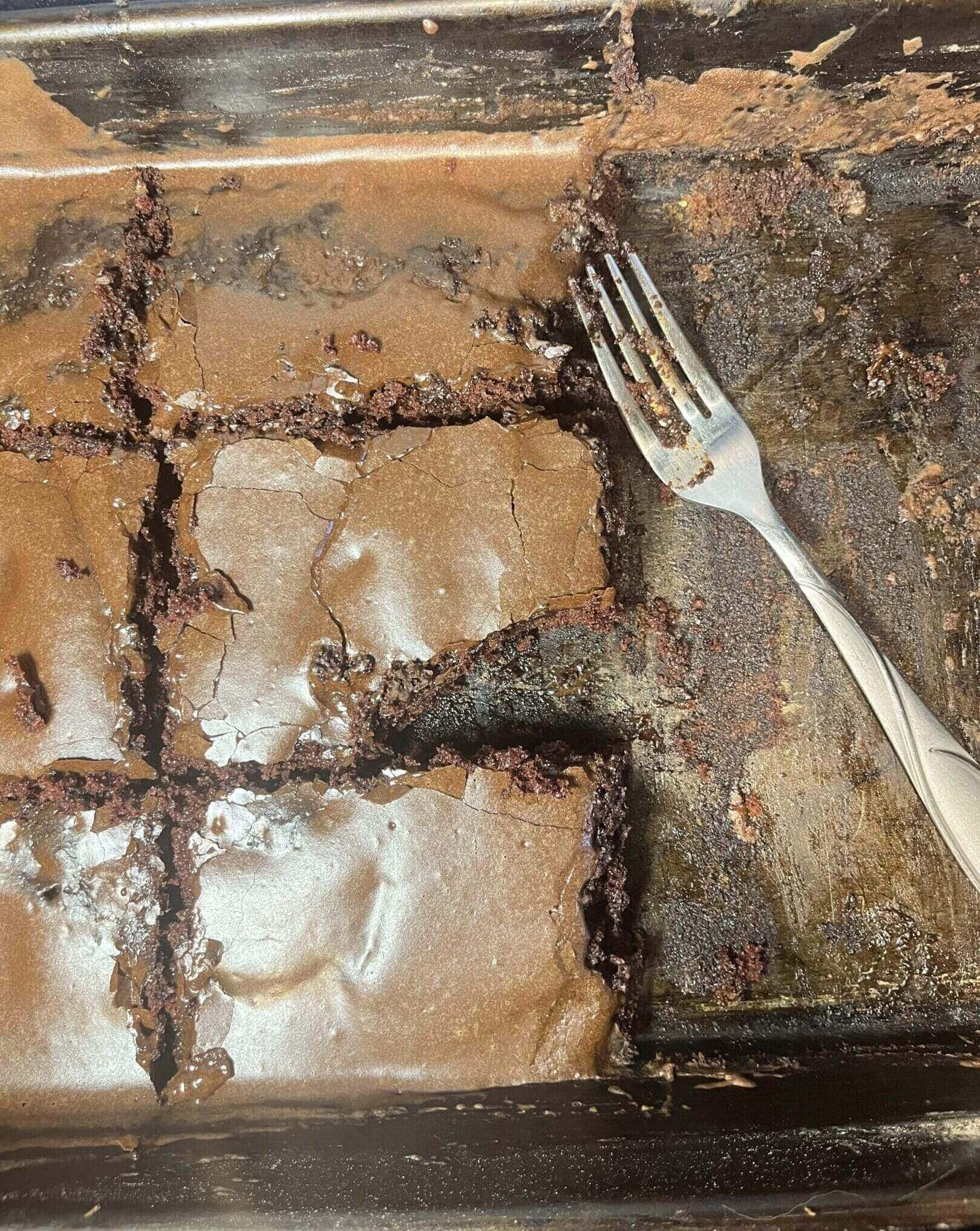 Brownies in a pan with a fork.