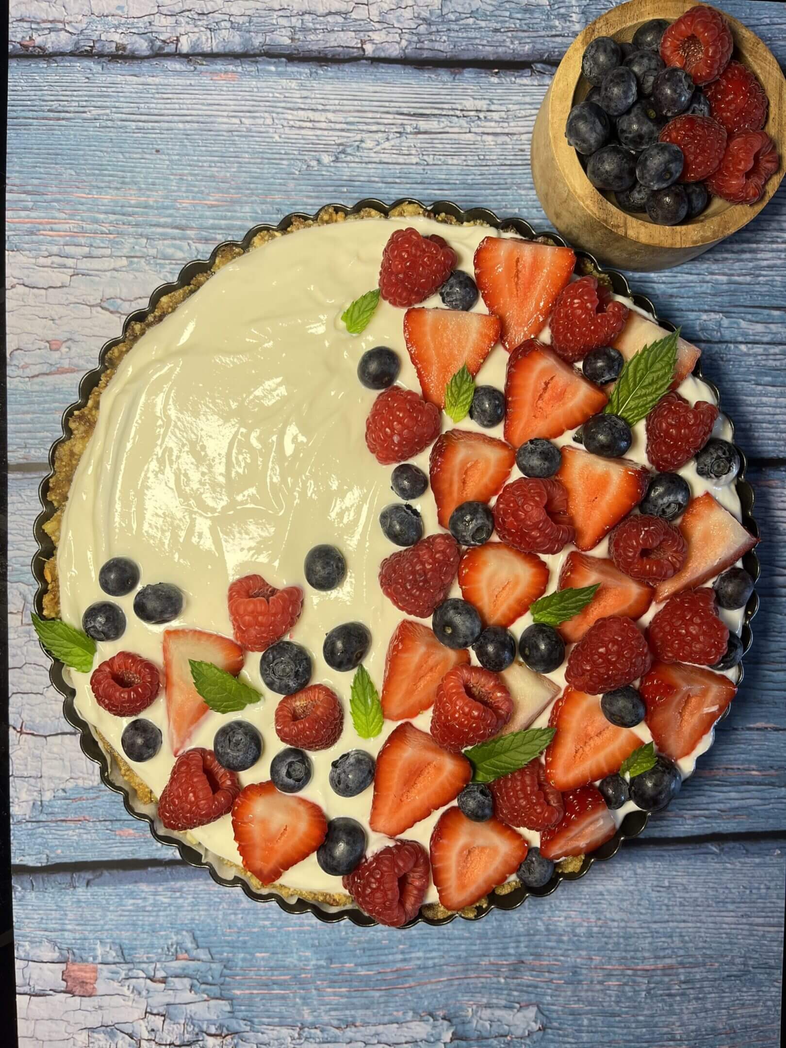 Berry tart with strawberries and blueberries.