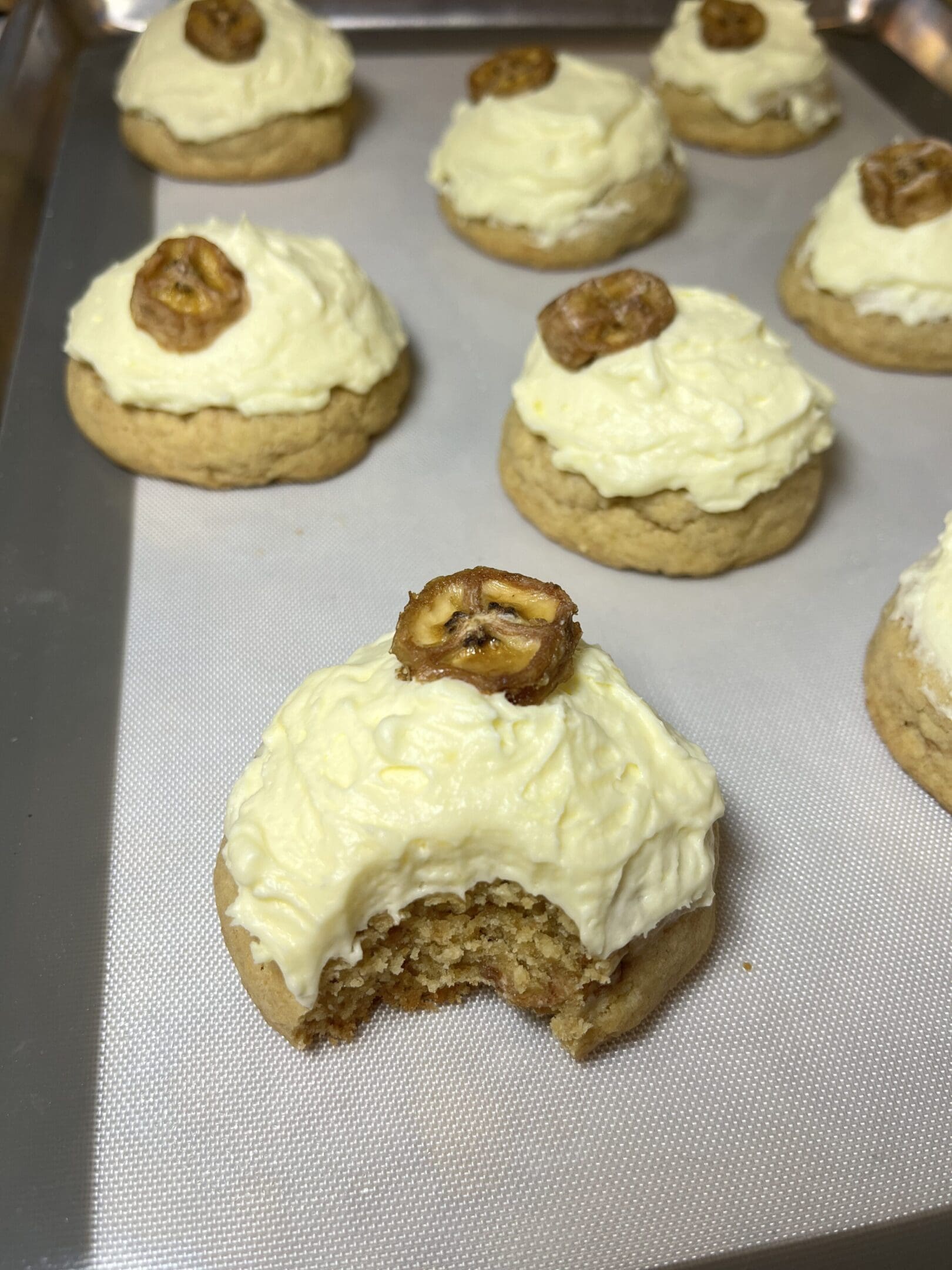 Cookies with frosting and pretzel topping.