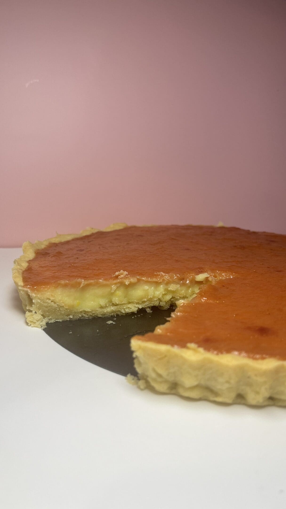 Caramel tart with slice removed.