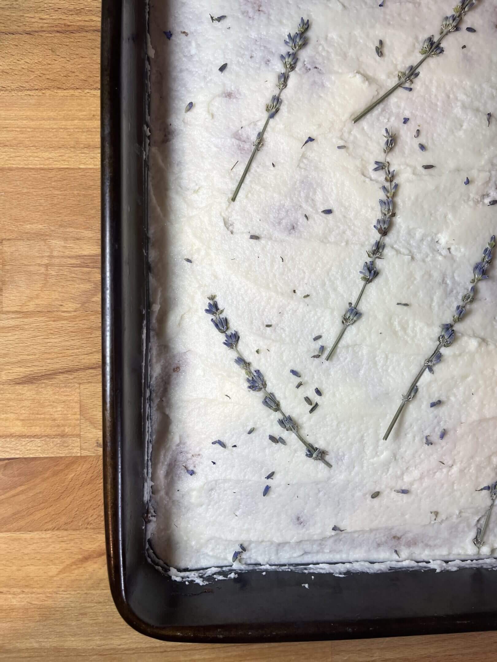 Cake with lavender on white frosting.