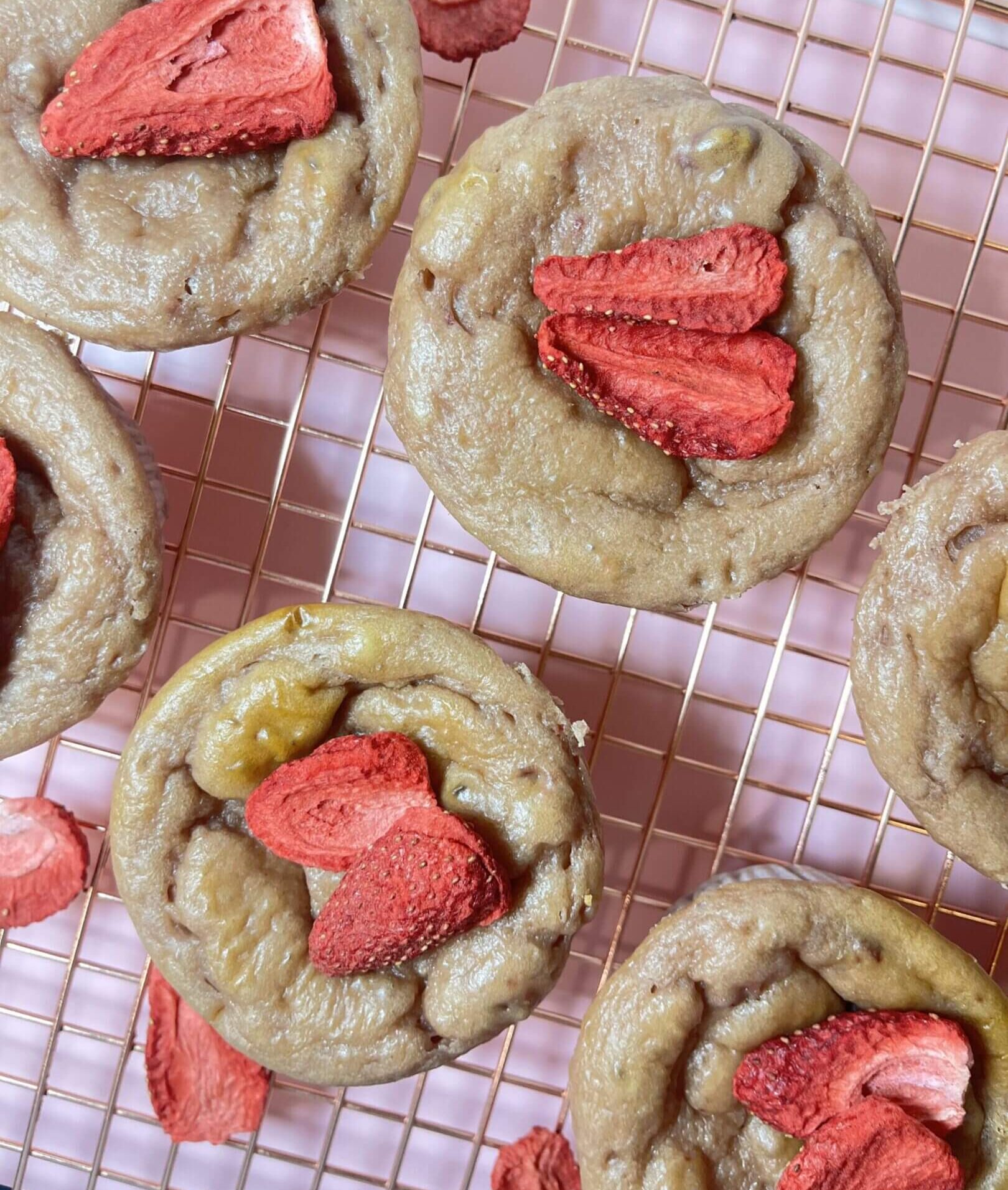 Banana muffins topped with dried strawberries.