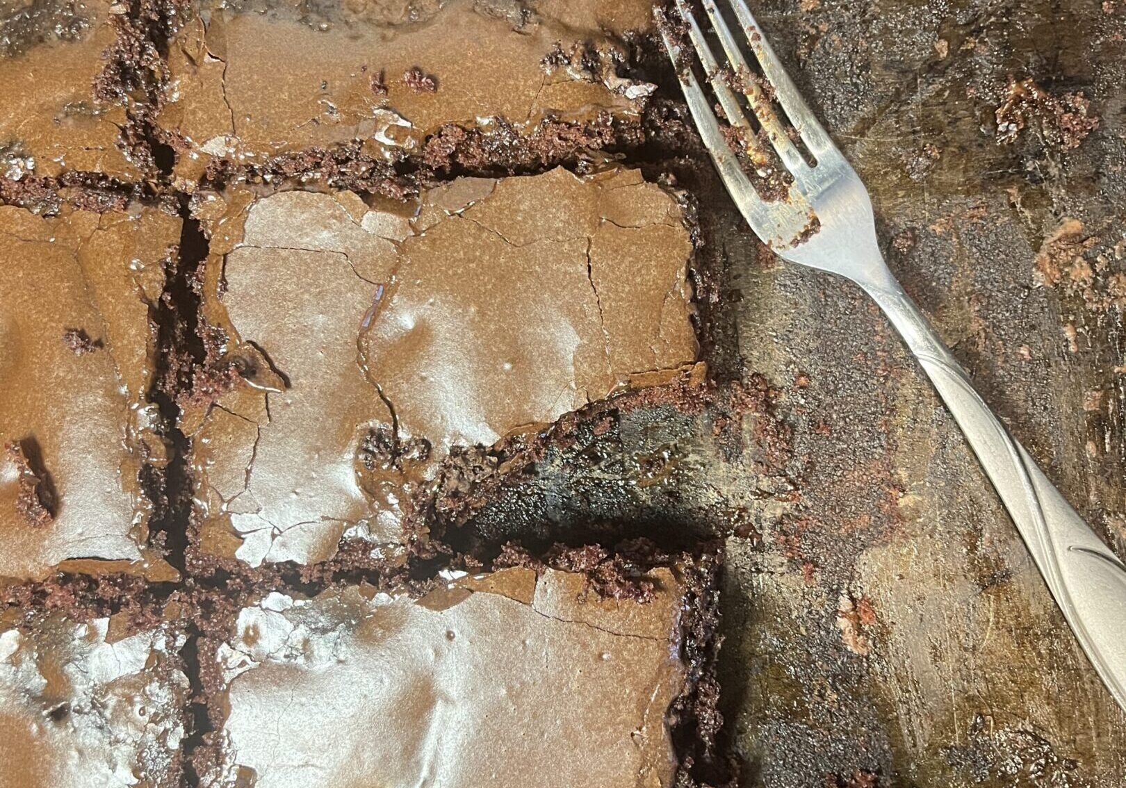 Brownies in a pan with a fork.