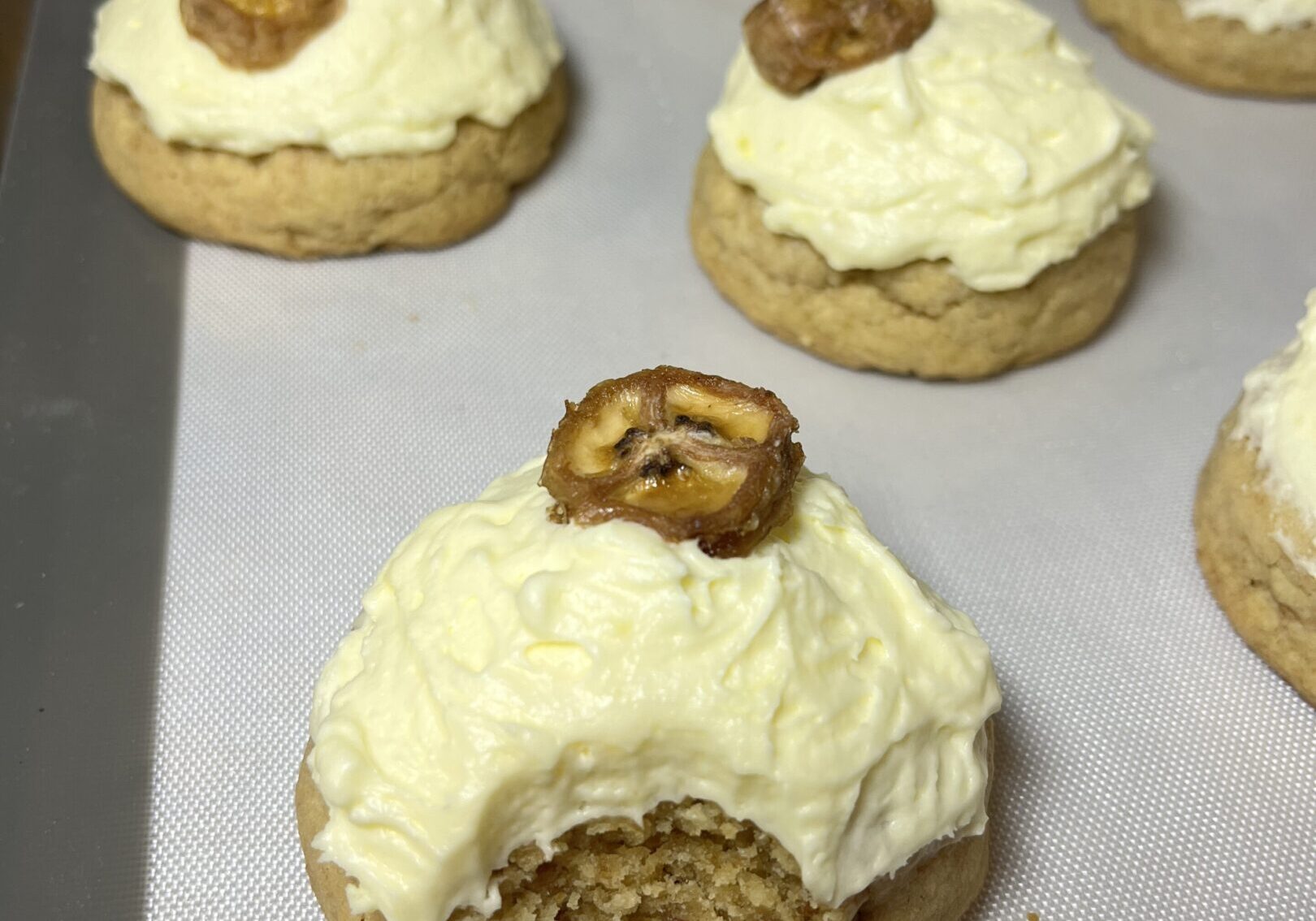 Cookies with frosting and pretzel topping.