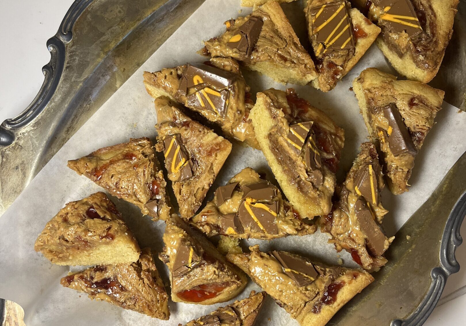 Peanut butter and jelly bars on tray.