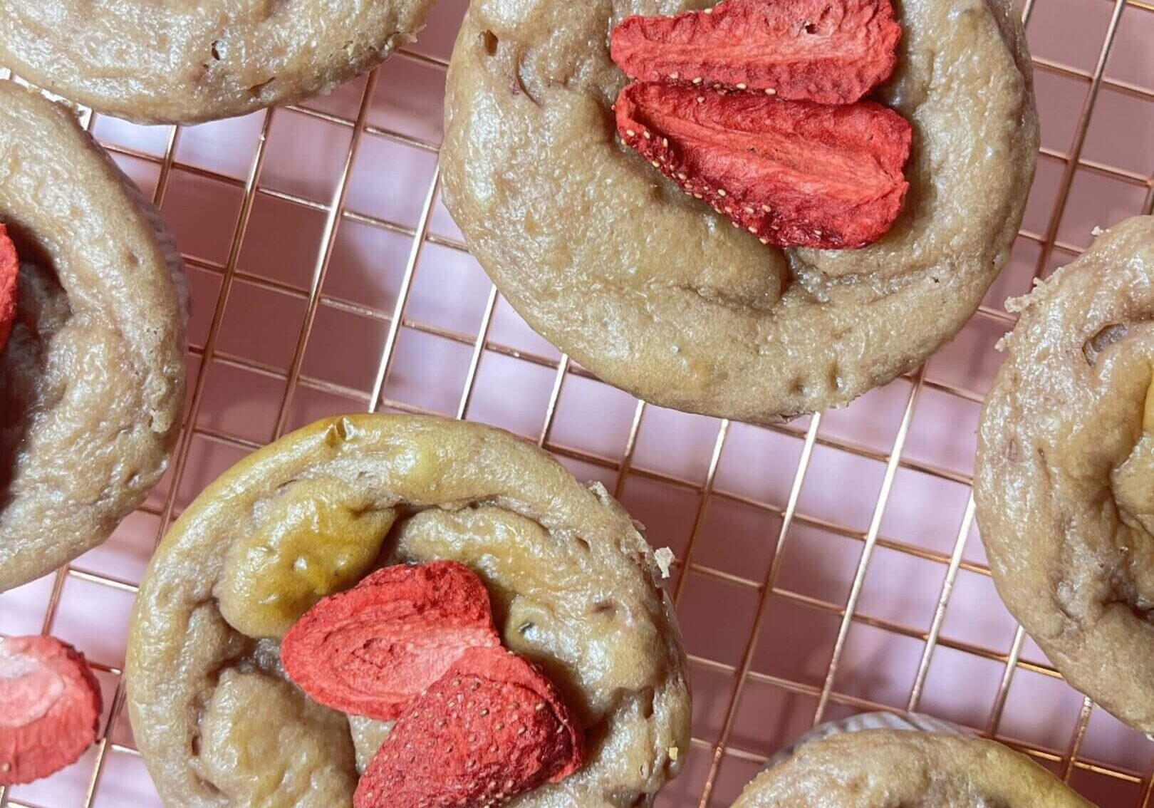 Banana muffins topped with dried strawberries.