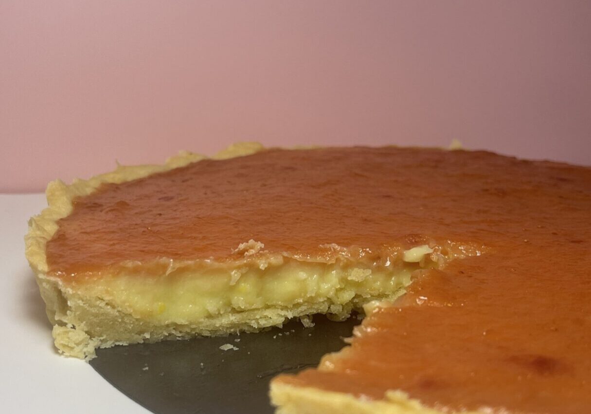 Caramel tart with slice removed.